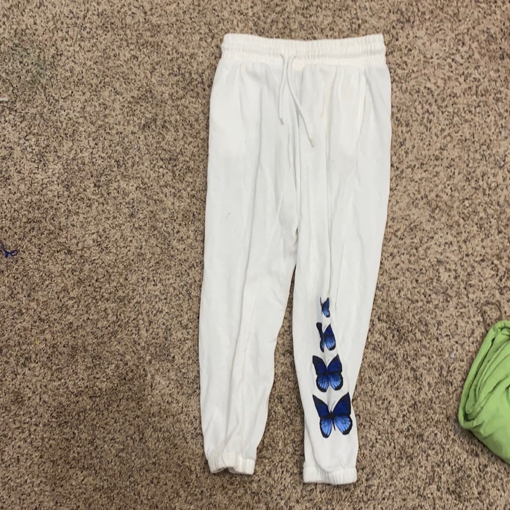 White sweatpants with blue butterflies